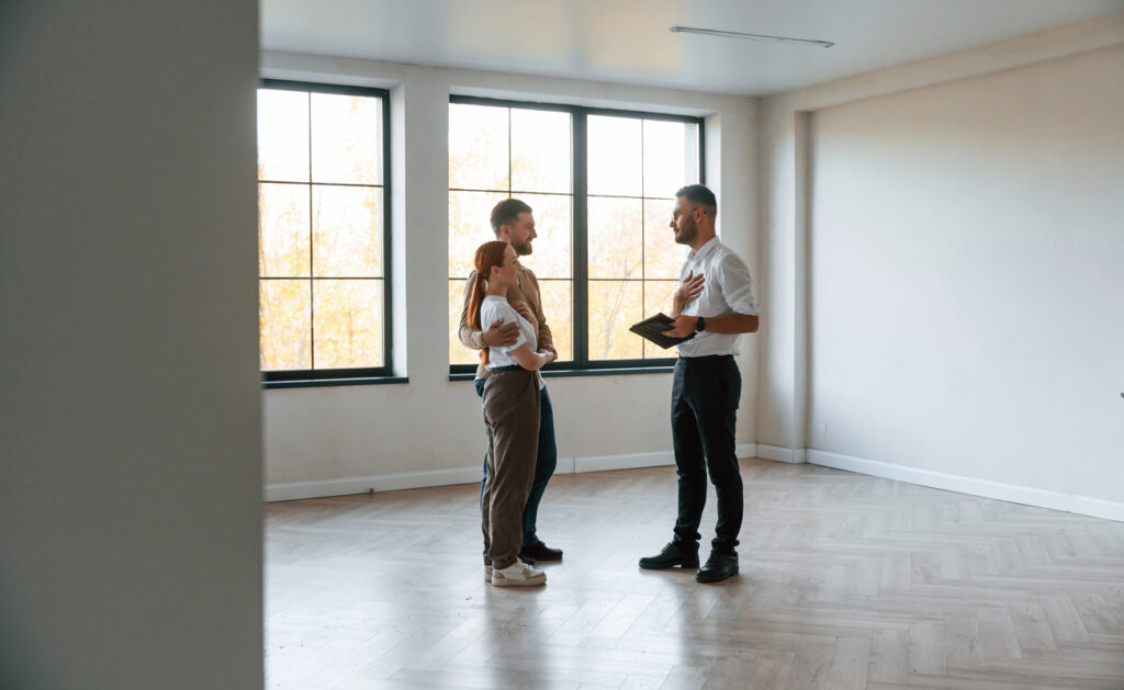 realtor showing a property to new tenants