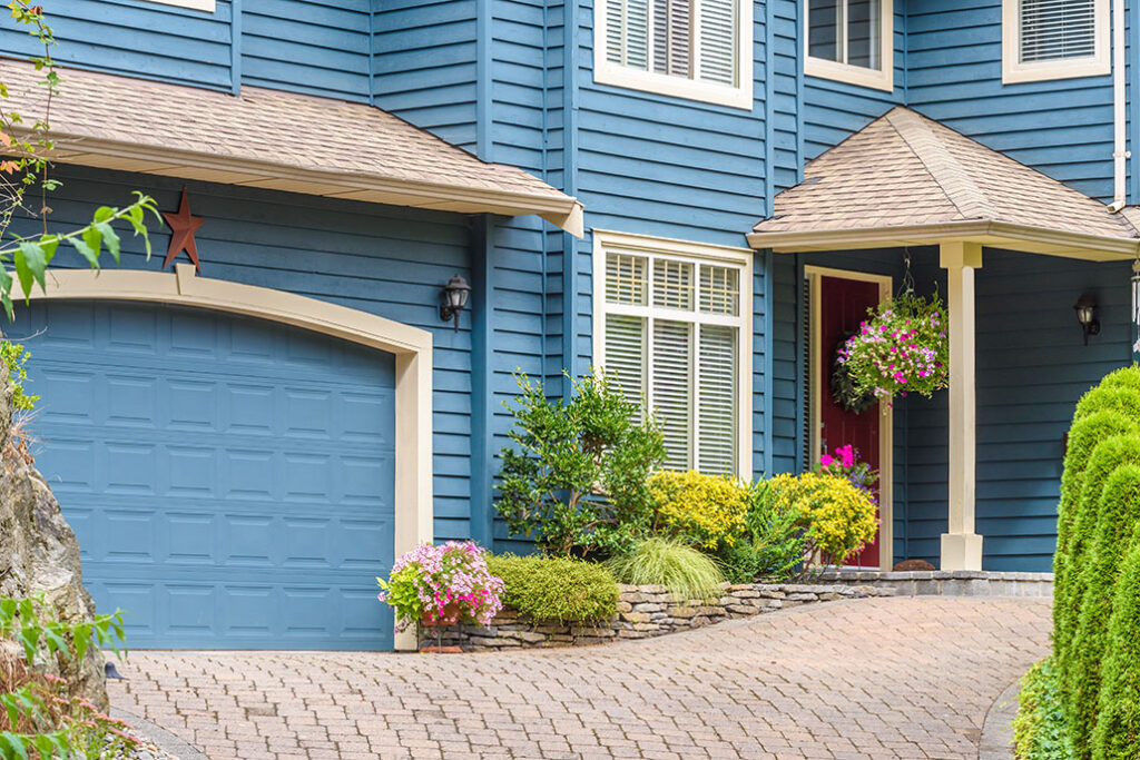 Fragment of a very neat and colorful home with gorgeous outdoor landscape in suburbs