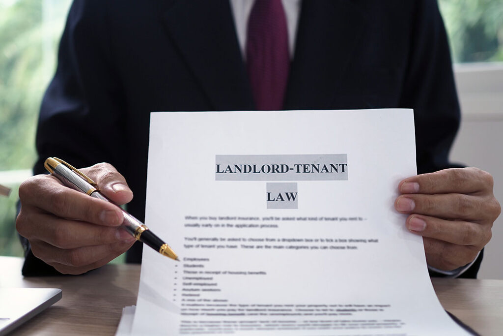 Realtor showing Landlord-Tenant Law document.